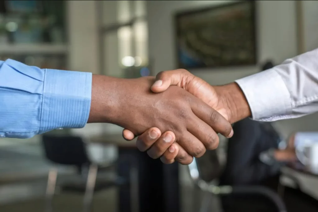 Two business professionals shaking hands