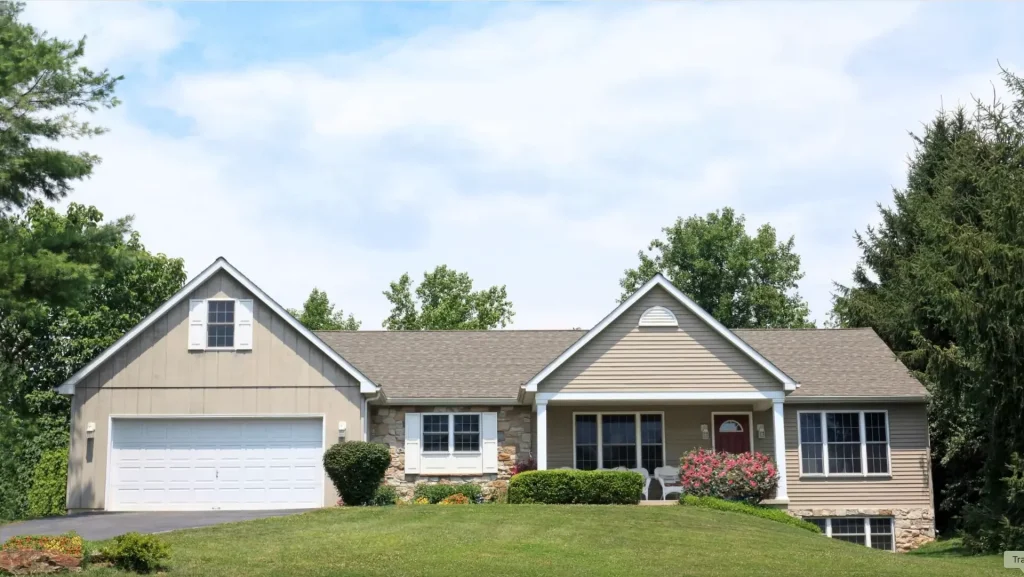 Two-story house with a basement and landscaped yard