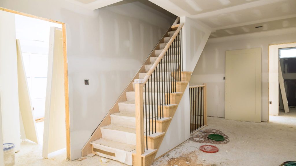 Home interior during remodeling with newly installed staircase