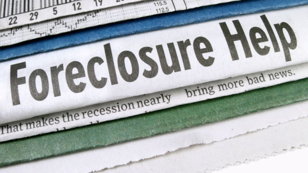 Newspaper headline reading Foreclosure Help
