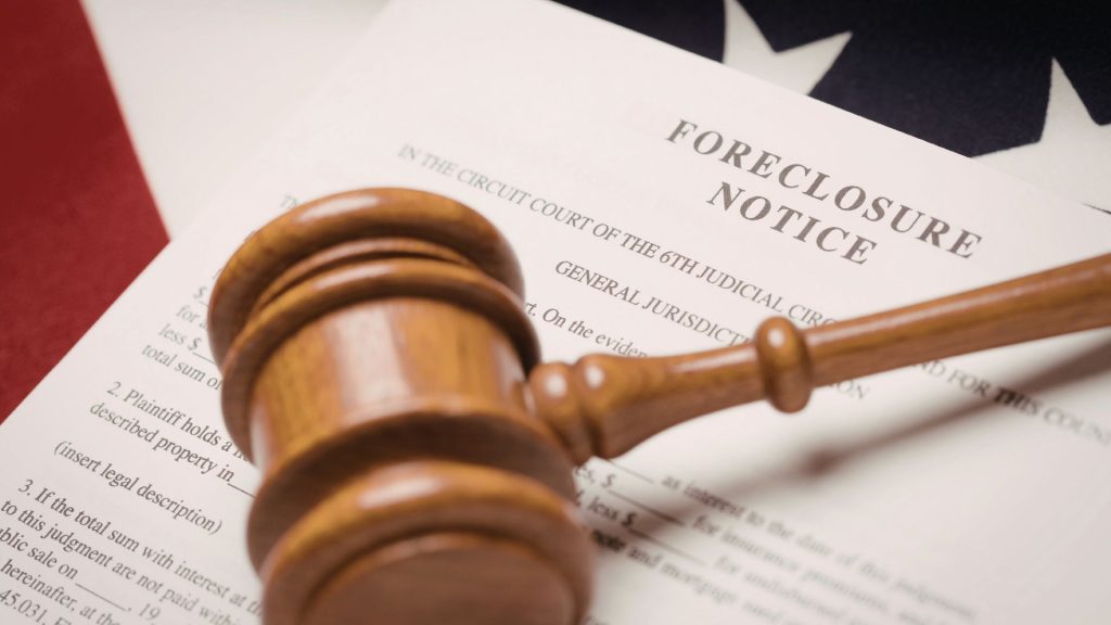 Judge's gavel resting on foreclosure notice