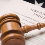 Judge's gavel resting on foreclosure notice