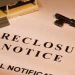 Foreclosure notice document with house model and key