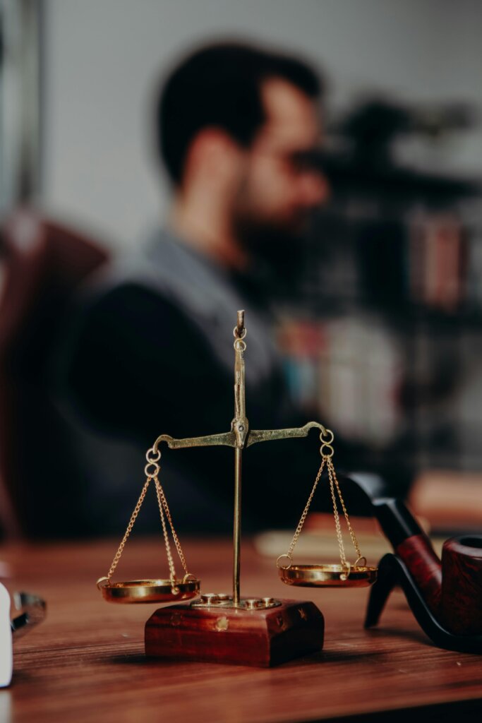 Scales of justice on desk in law office