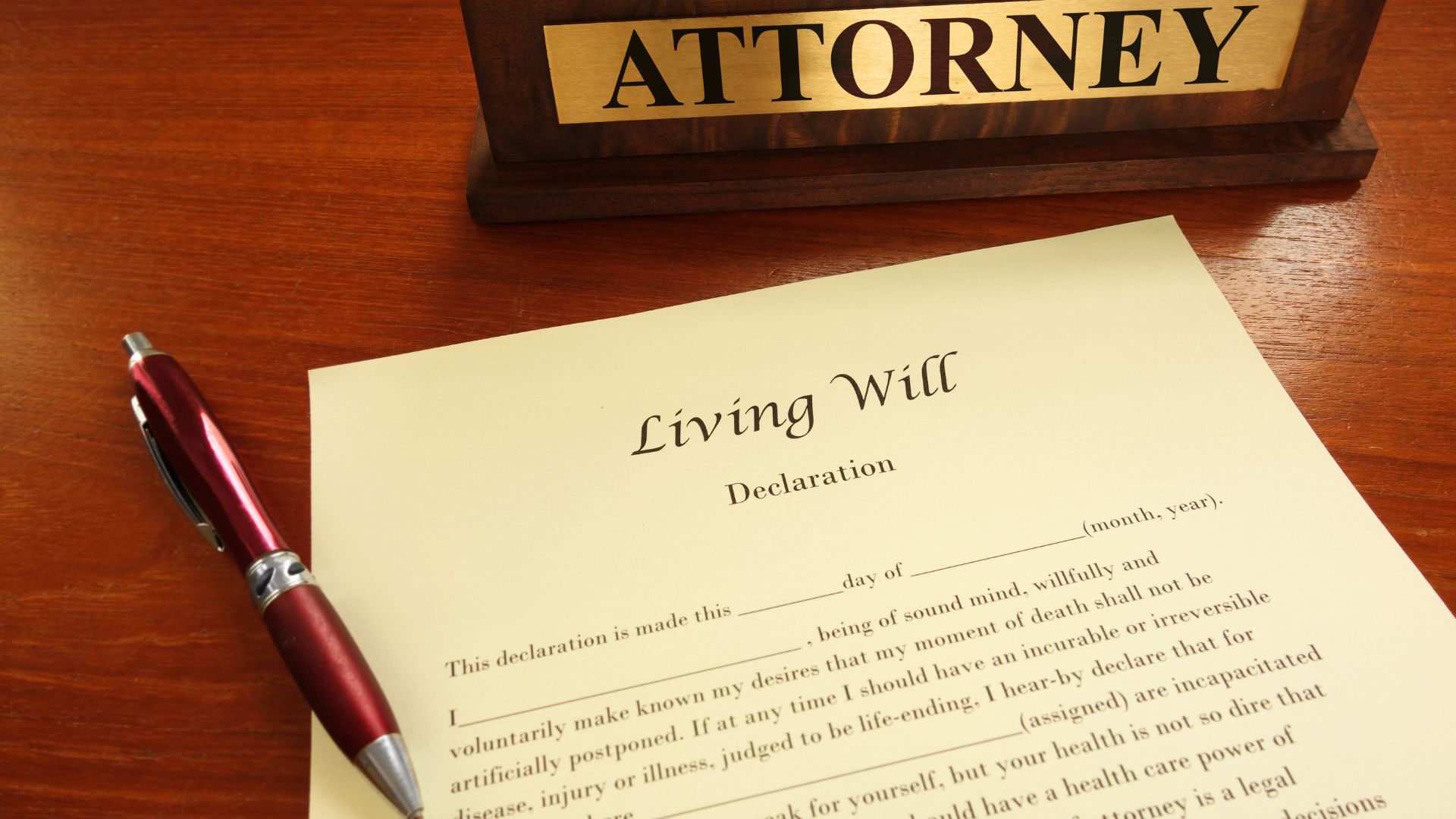 Living will document on desk with attorney nameplate