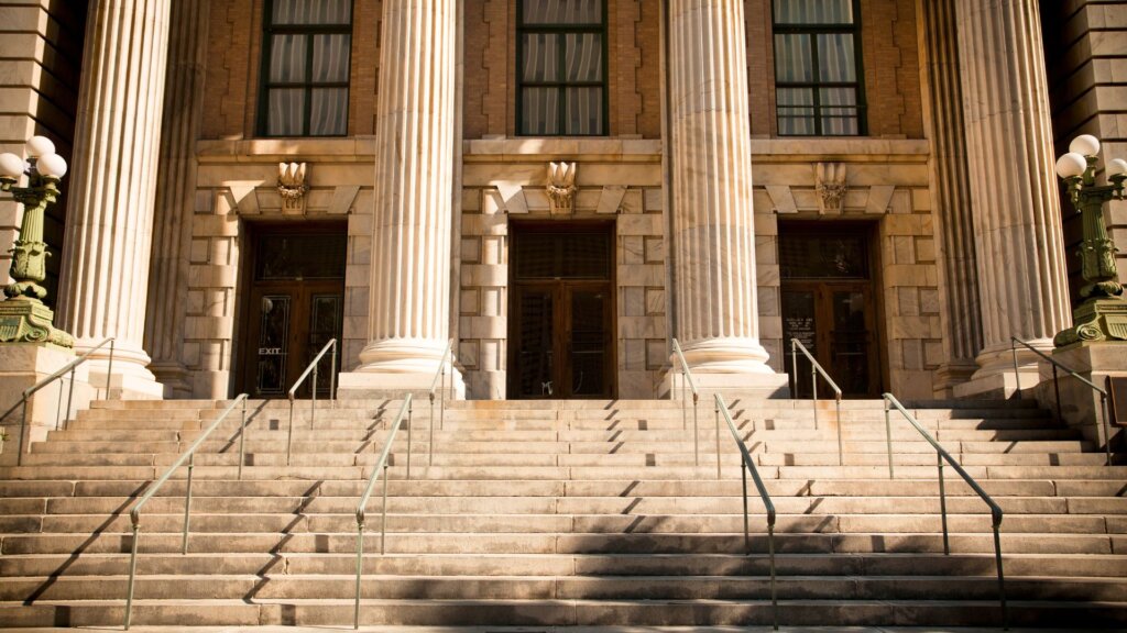 Exterior of courthouse with stone steps and columns