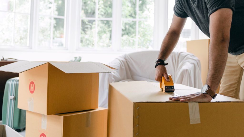 Homeowner packing boxes during a move
