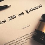 Last will and testament document with judge’s gavel and pen