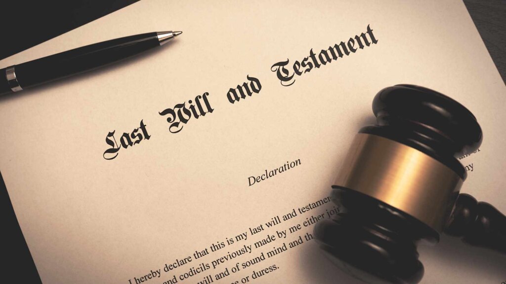 Last will and testament document with judge’s gavel and pen